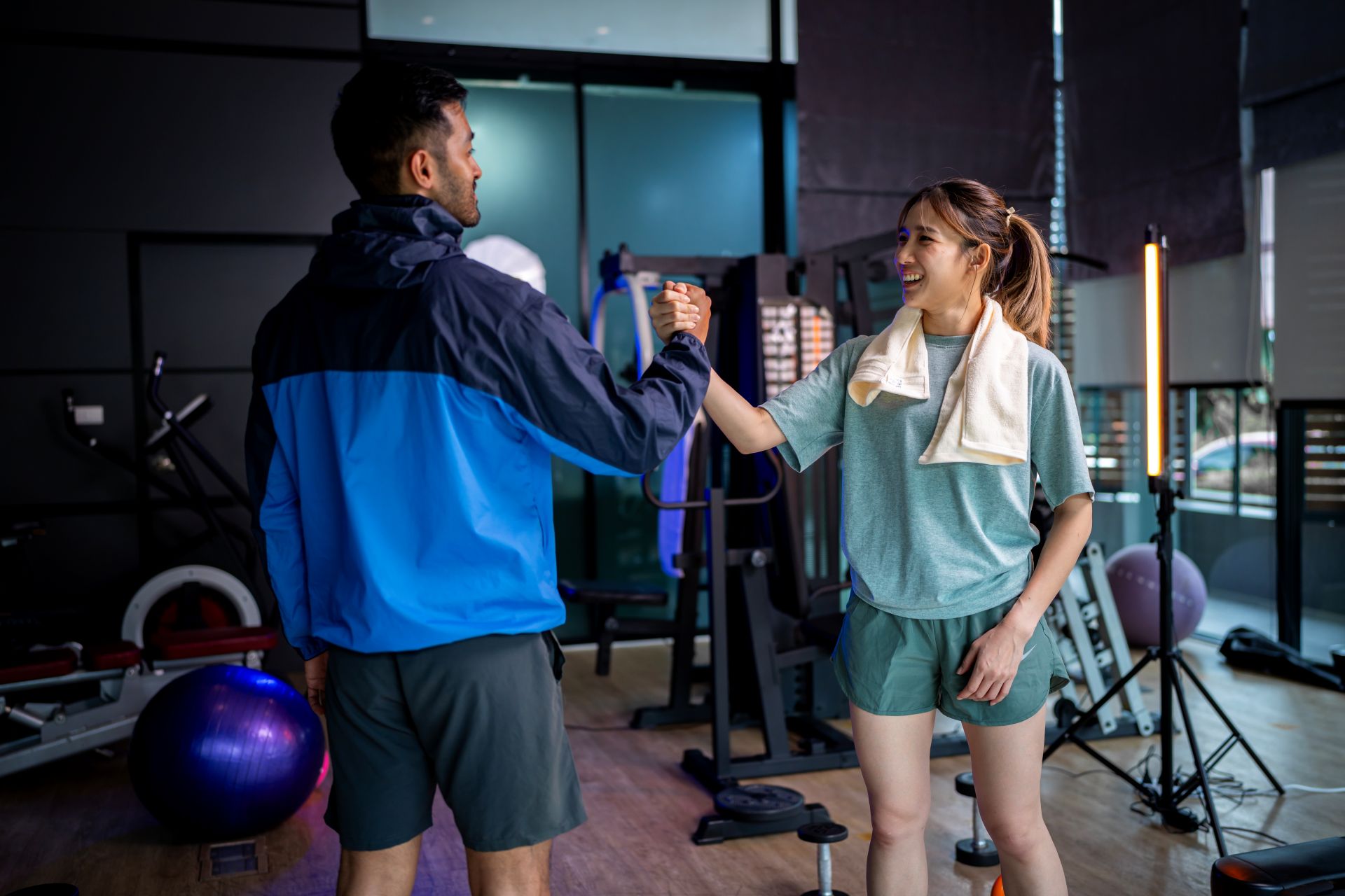 asian_man_and_woman_working_out_one_is_a_trainer_2024_09_27_00_10-1.jpg